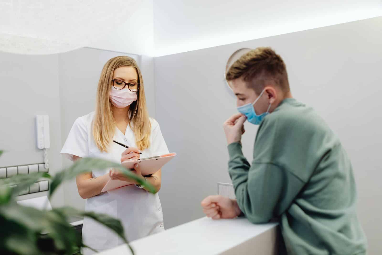 Dr. Reid Amedee with a patient