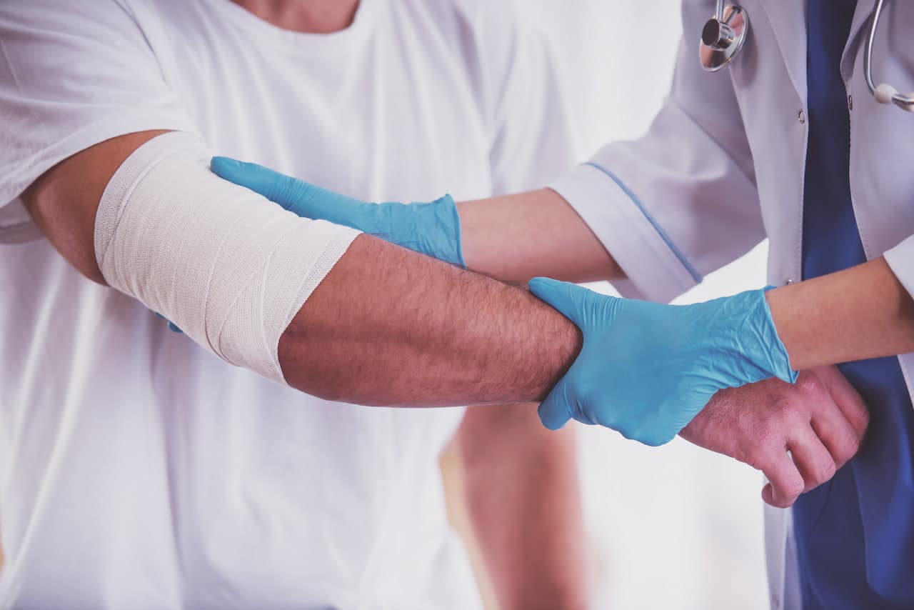 A doctor checking his patient injury