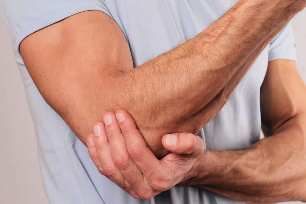 A man having an Elbow Pain Treatment in The Woodlands
